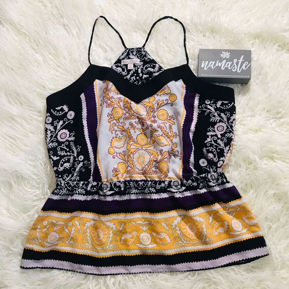 Eva Mendes sleeveless blouse.